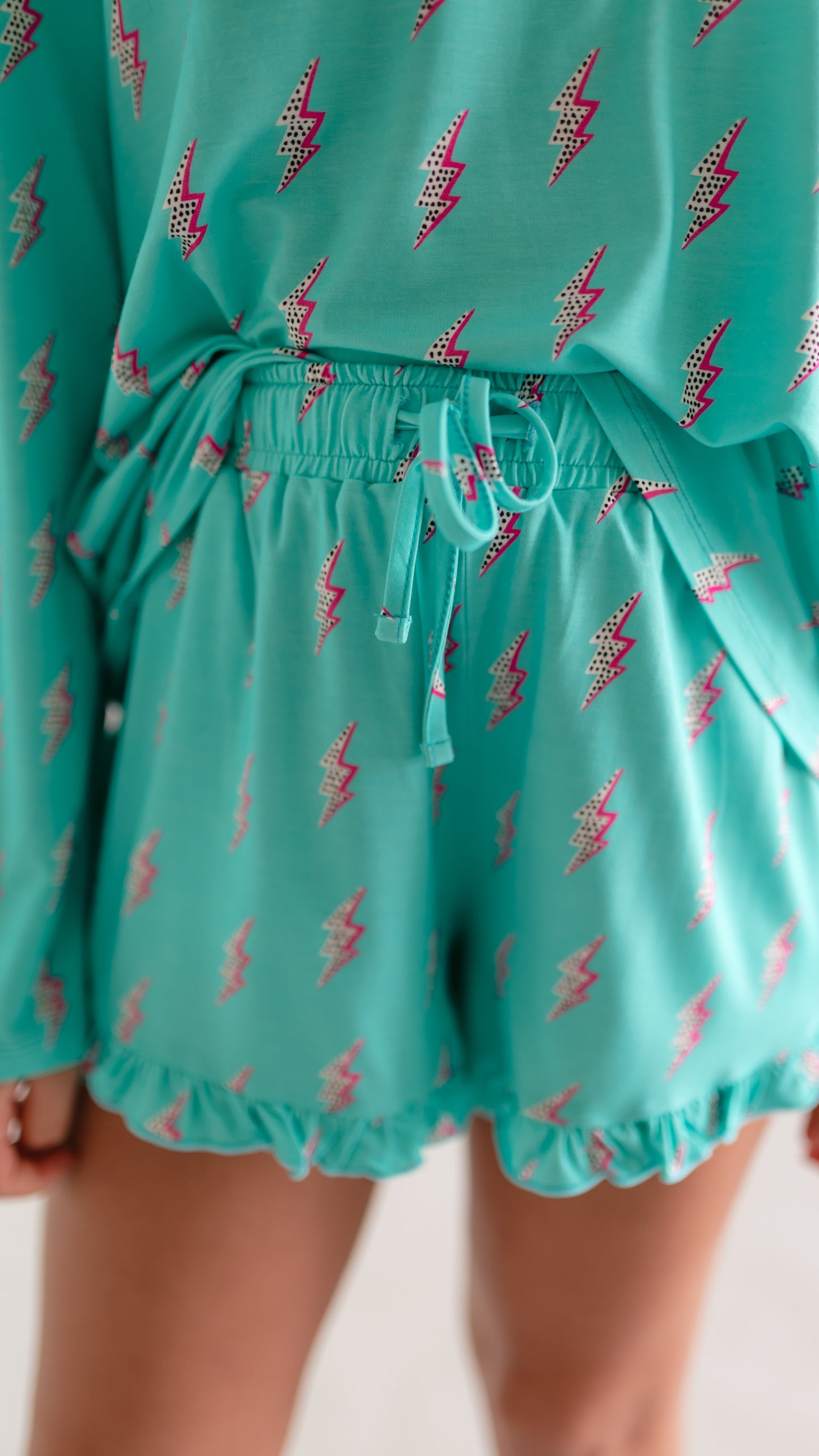Girl's Long Sleeve and Ruffle Shorts Set in Neon Bolts