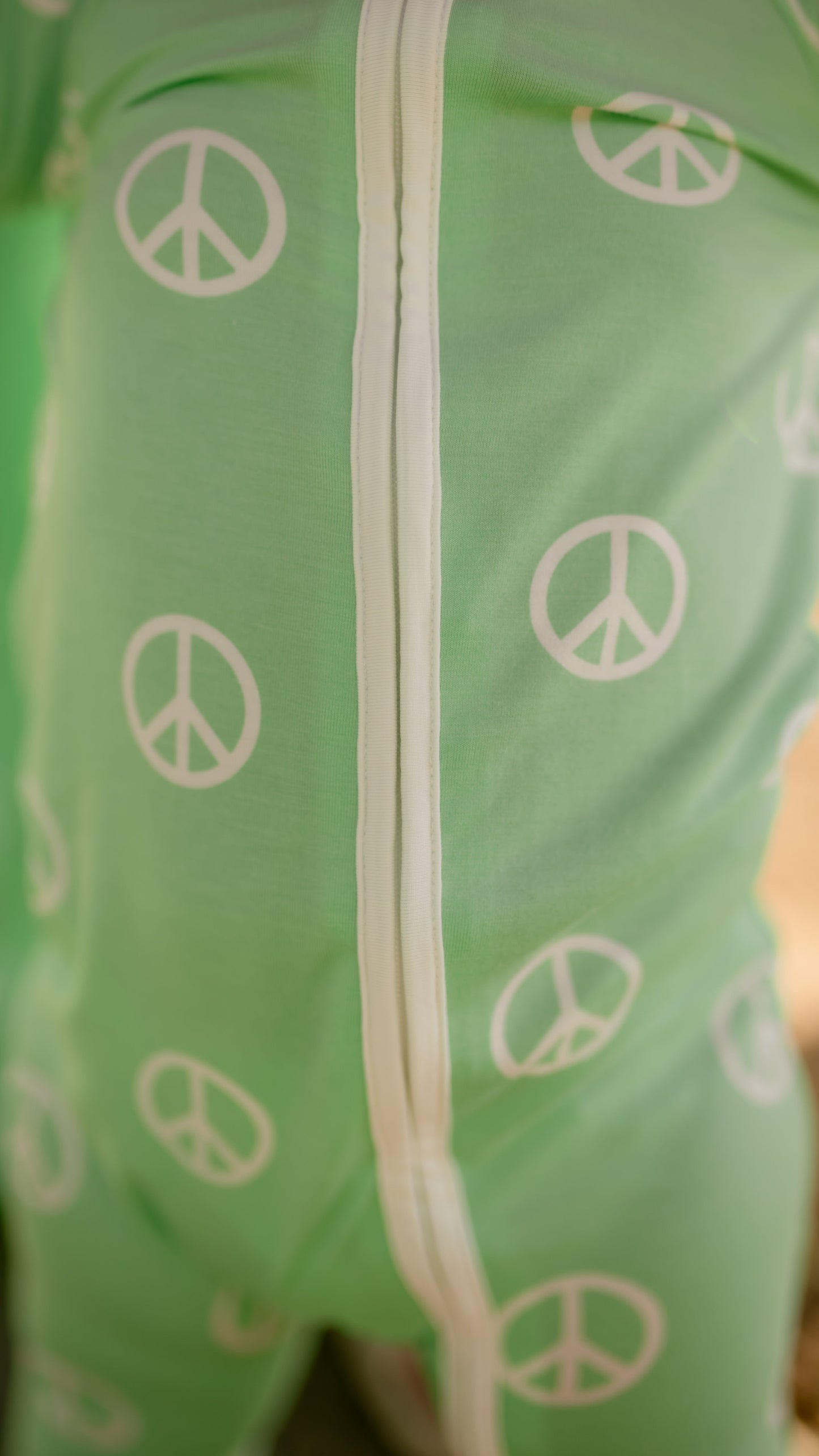 Infant Romper in Groovy Peace Signs