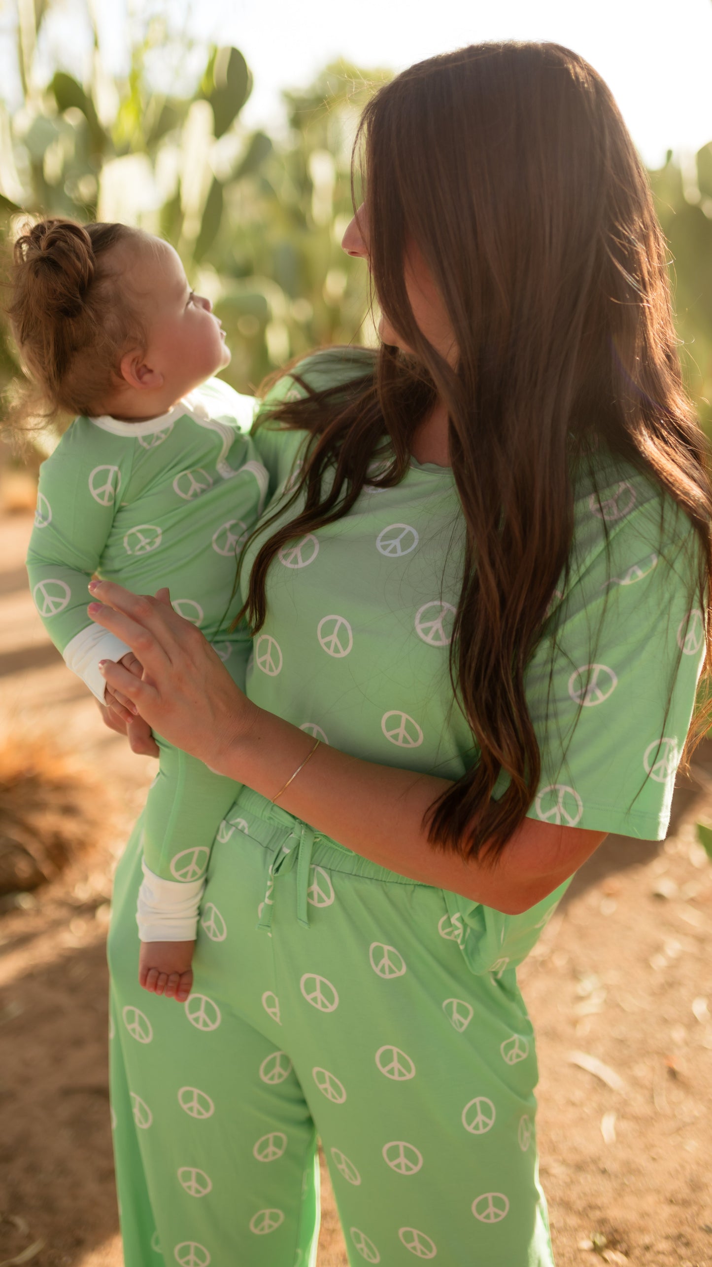 Infant Romper in Groovy Peace Signs