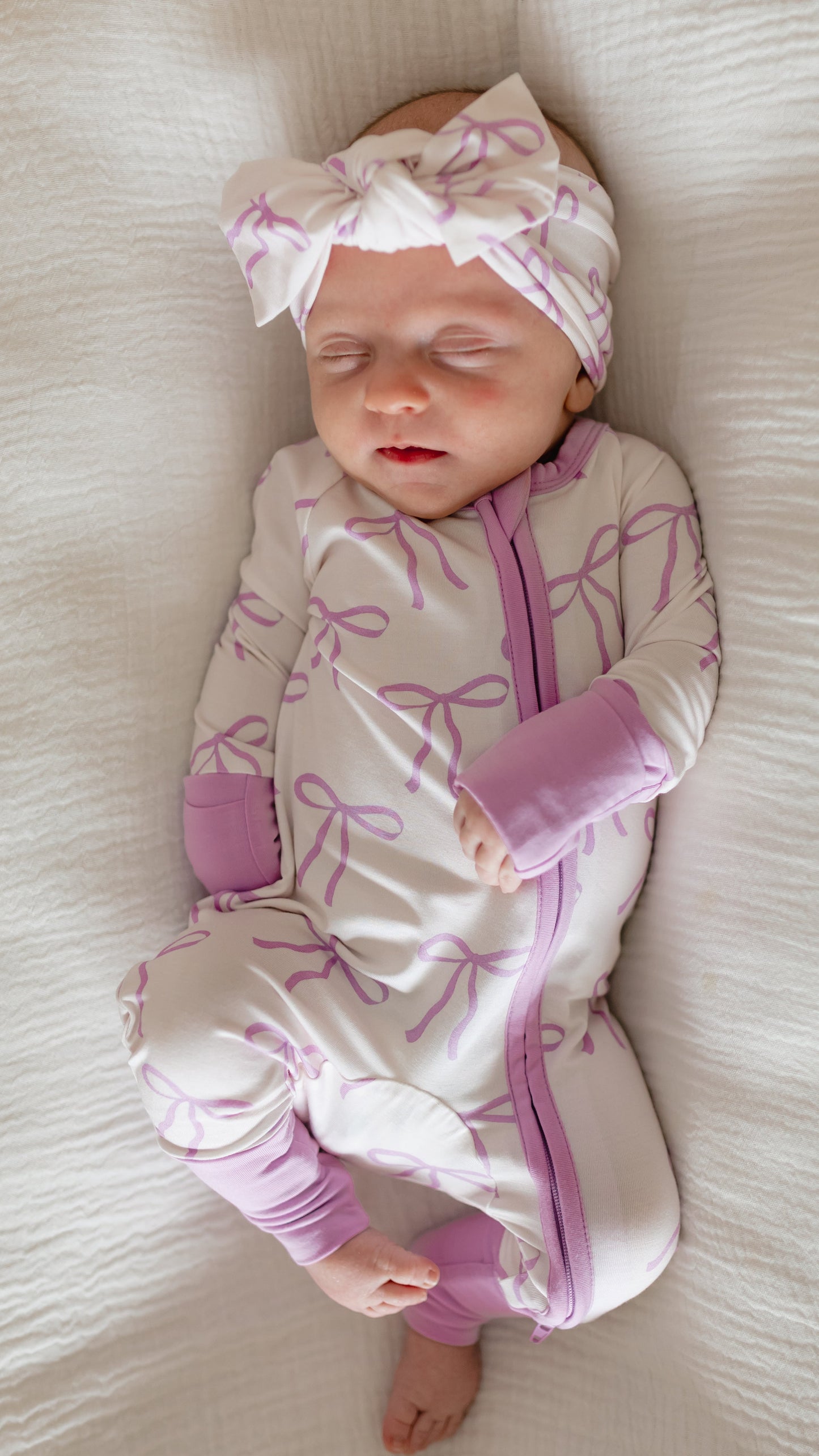 Infant Romper in Purple Bows