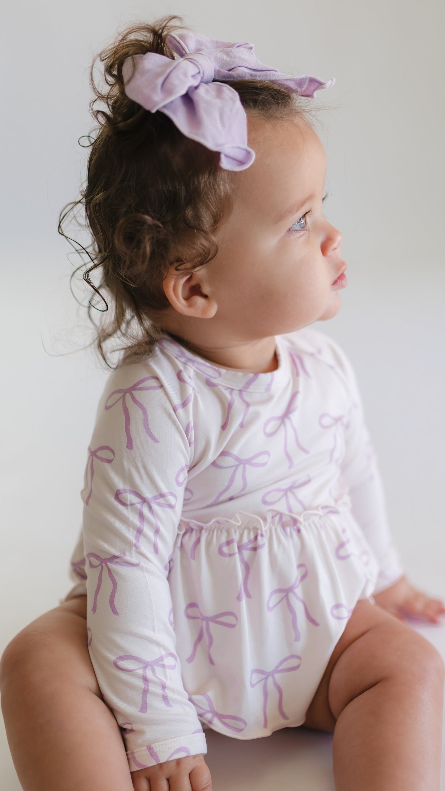 Infant Long Sleeve and Skirt Onesie in Purple Bows