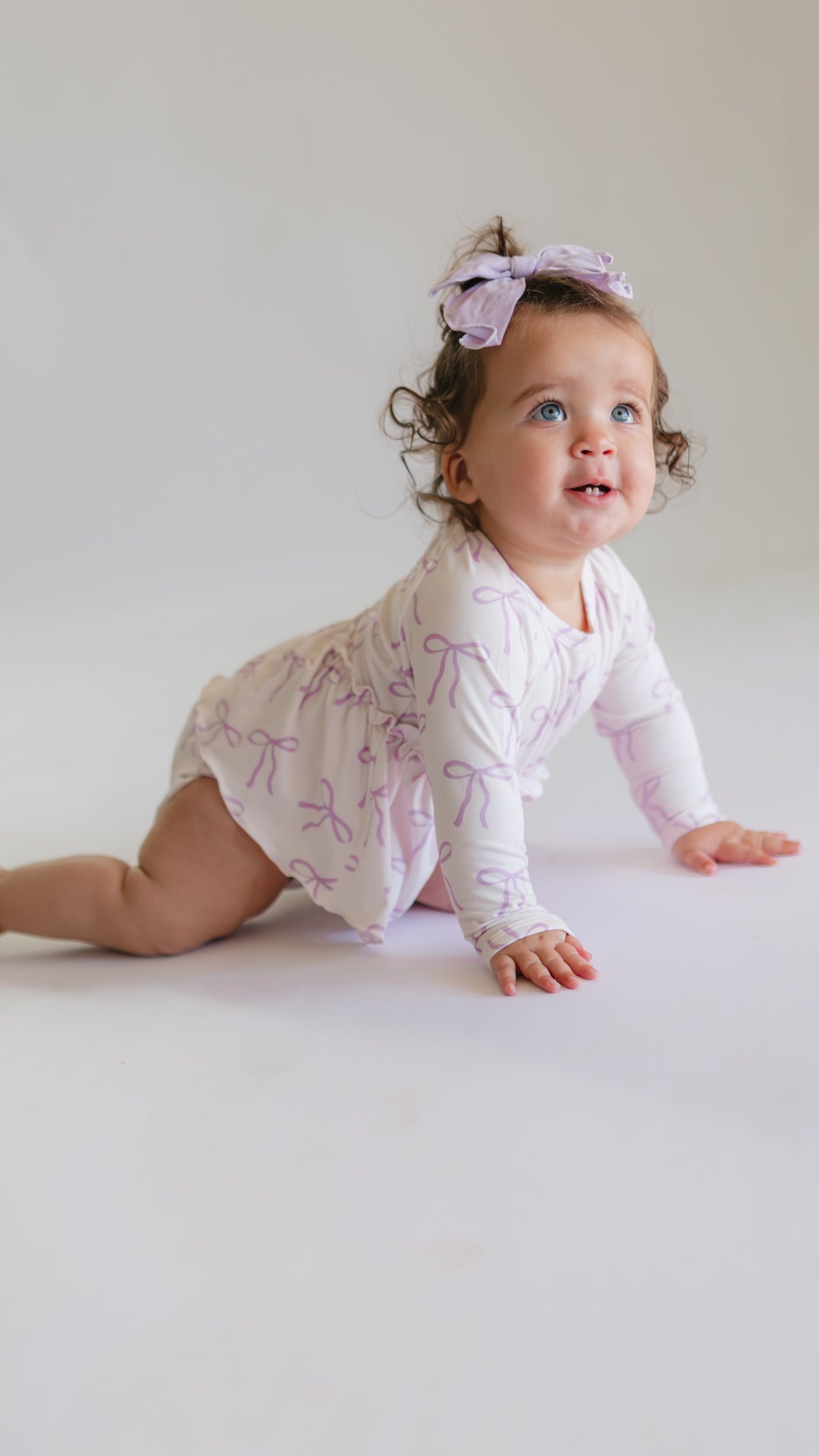 Infant Long Sleeve and Skirt Onesie in Purple Bows